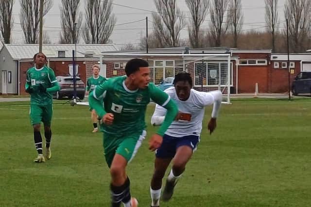 North End's Michael Ayodele chases for the ball