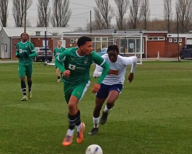 North End's Michael Ayodele chases for the ball