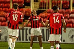 Miguel Azeez celebrates scoring Morecambe’s third goal with Ben Tollitt and Alie Sesay (photo: Morecambe FC)