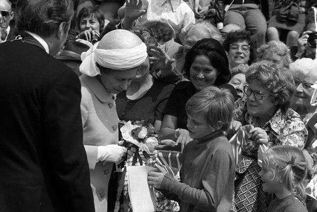 The Queen meets a young boy during her Silver Jubilee tour in Preston, June 1977