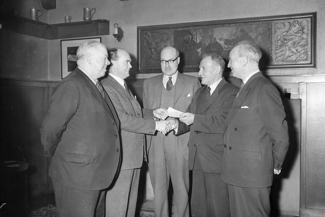 A retiral presentation to employee William Reid from Mr J J Gardiner on behalf of Edinburgh's Abbey Brewery in February 1960.