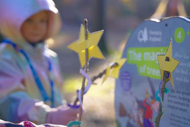 A child with a Room on the Broom magic wand