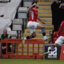 Cole Stockton celebrates scoring Morecambe's late equaliser (photo: Ian Lyon)