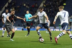 Preston North End's Ched Evans under pressure in the Bristol City penalty area