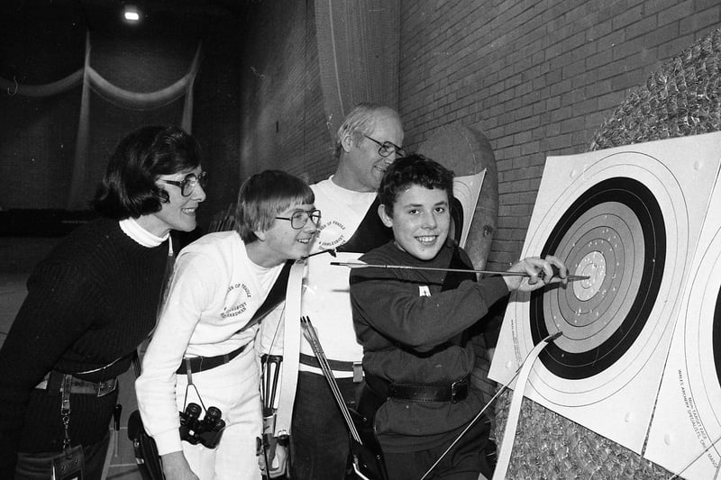 It's a gold for Stephen McGee of Hoghton who competes in Chorley Bowmen's second indoor archery tournament at Clayton Green Sports Centre, watched by, from left: June Booth of Preston, Nigel Hardman and Edwin Hardman of Penwortham