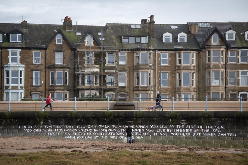 The poem by Lemn Sissay was painted on the wall at the beach.