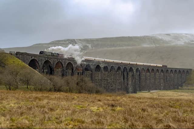 The Northern Belle steams its way over the Ribblehead Viaduct.