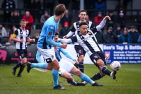 Chorley's Adam Henley plays the ball forward against Southport on Saturday (photo: Stefan Willoughby)