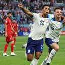 England's Jude Bellingham (left) celebrates opening the scoring against Iran with Mason Mount Picture: Clive Brunskill/Getty Images)