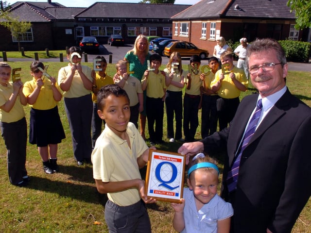 Fulwood and Cadley Primary School receive a quality mark plaque in 2008 for their achievements. Pictured (front) Ned Ratcliffe, assistant director of NIACE, with pupils Rowan Gill and Jessica Kitchen