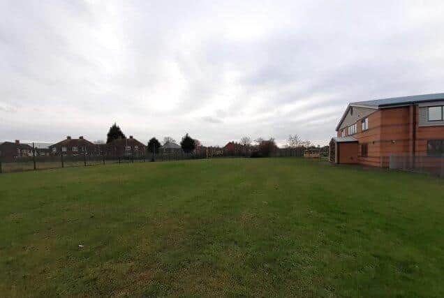 The grassed area where the new playground would be built (image via Preston City Council planing portal)