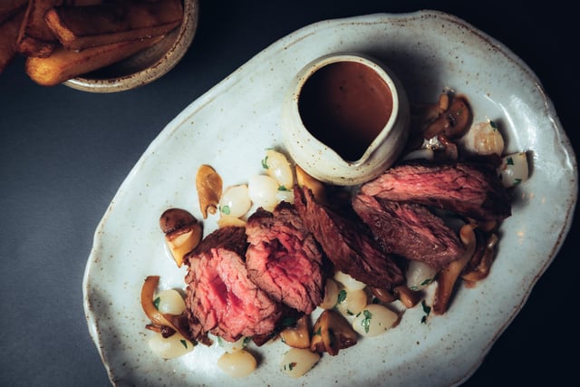 40 day dry aged bavette steak with confit baby onions, foraged Mushrooms, peppered Beef Sauce