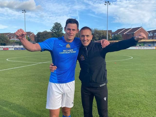 Clitheroe's joint managerial duo Billy Priestley and Kyle Hall celebrate the FA Cup win over Spennymoor Town