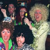 Enjoying the Millennium fun in Yates' s jWine Lodge, Preston, are this group of revellers from Ashton