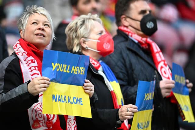 Football fans around the world have shown unity with Ukraine