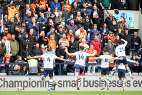 Preston North End players celebrate in front of the Blackpool fans after Brad Potts opened the scoring