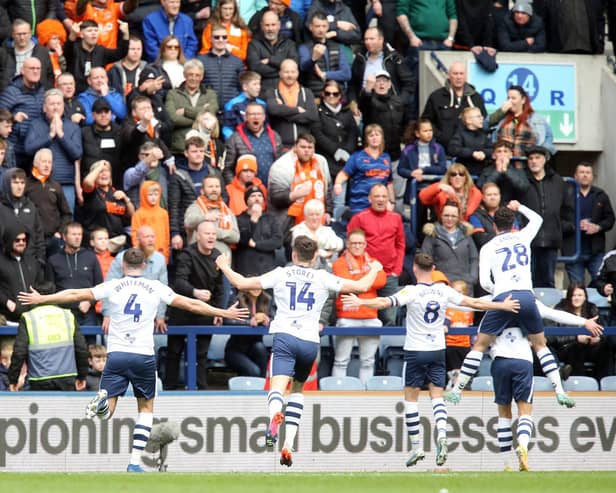 Preston North End players celebrate in front of the Blackpool fans after Brad Potts opened the scoring