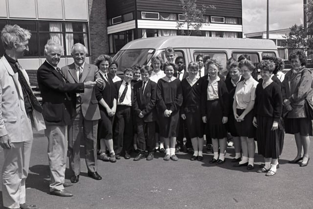Parents, teacher and pupils have pulled together to put a high school on the road. They raised £7,000 towards a £10,000 minibus at Tulketh High School, Preston, through two years of hard work in various events. Pictured above, Mr Ralph Jones, headmaster, receives the keys to the new bus in 1988