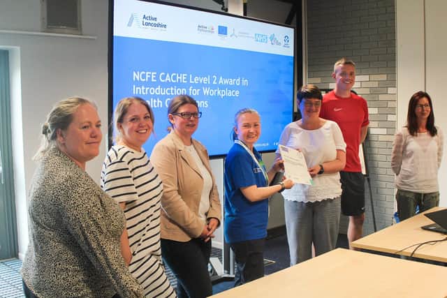Tanya Wilson, a Workplace Health Champion trainer from South Ribble Borough Council, presenting certificates to newly qualified Workplace Health Champions at the Civic
Centre, South Ribble Borough Council, Leyland