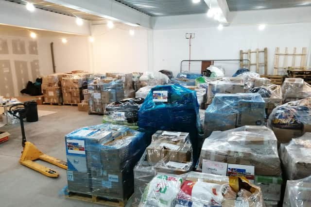 Pallets of donations inside the Chorley & District Support for Ukraine donations unit