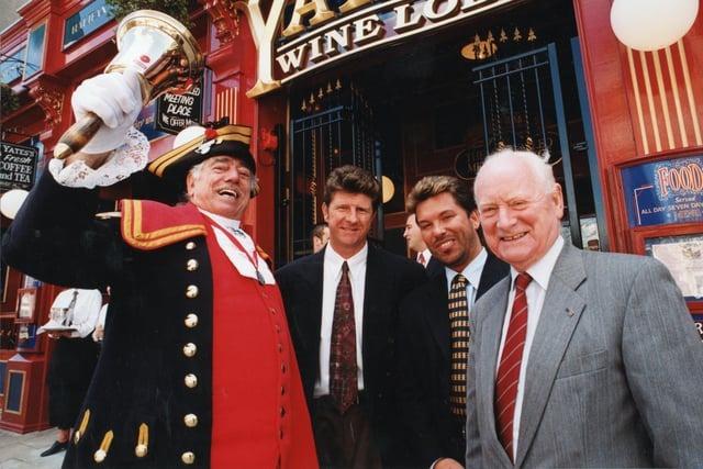 Some very familiar faces here - Preston town crier Roy Harness has plenty to shout about with the grand reopening of Yates's Wine Lodge after a facelift in 1995. He is pictured alongside Gary Peters, boss of Preston North End, pub manager David Robertson, and PNE legend Sir Tom Finney