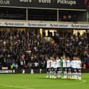 Preston North End players acknowledge a minute’s silence for Her Majesty Queen Elizabeth II.