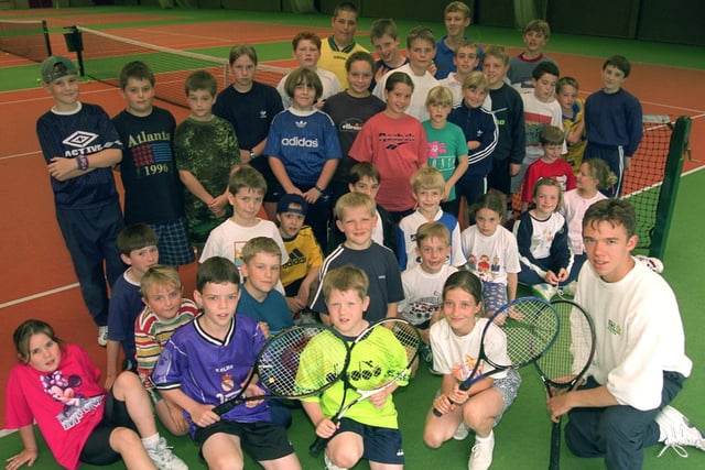 Tennis coach Chris Anders with summer tennis camp members at South Ribble Tennis Centre, Bamber Bridge, Preston