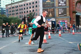 Production engineer Nick Owen hopes to have set a new world record… as the fastest man to run the Manchester half marathon dressed as a snooker player!