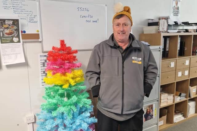 Martin Pilling, delivery driver at Wiltshire Farm Foods, wearing his knitted hat from a customer.