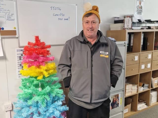 Martin Pilling, delivery driver at Wiltshire Farm Foods, wearing his knitted hat from a customer.