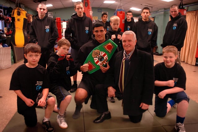 Preston and Fulwood Boxing Club community development officer Brian Beck with members in the new tops he presented to them in recognition of the progress they have made over the past year