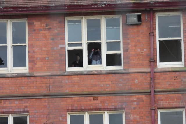 The youths appear unconcerned that they can be seen and even caught on camera