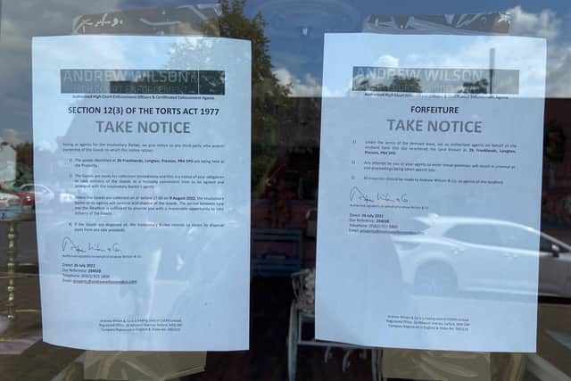 The bailiffs appear to be acting on behalf of the landlord and legal notices have been taped to the cafe windows