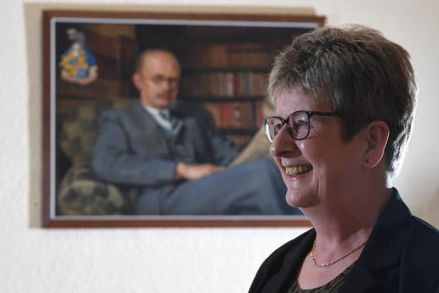Jacquie Crosby pictured in front of a painting of Reginald Sharp France,who was the county's archivist from 1940 -1976.   Photo:Neil Cross
