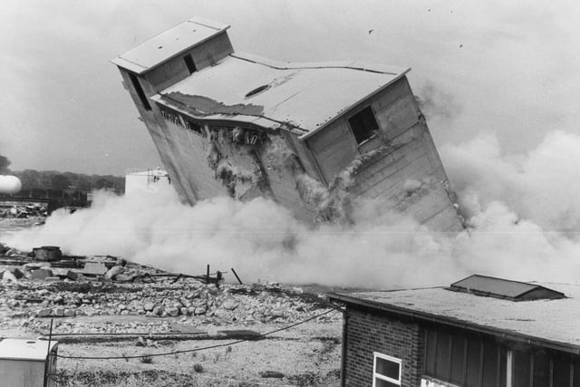 In 1978, when this picture was taken, demolition contractors blasted a 2,000-ton coal-bunker in the disused gasworks at Lostock Hall, reducing the landmark to rubble in just three seconds