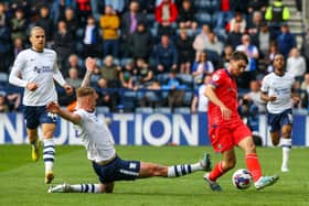 Preston North End's Patrick Bauer slides in on Blackburn Rovers' Harry Pickering