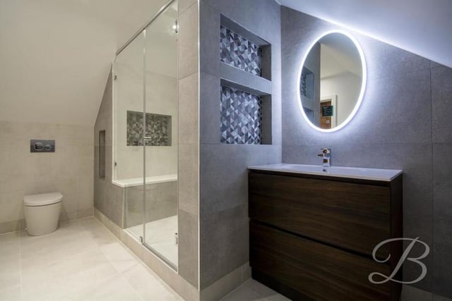 The en suite to the master bedroom is quite superb. A contemporary, enclosed shower is complemented by a vanity unit, low-flush WC, illuminated mirror and heated towel-rail.