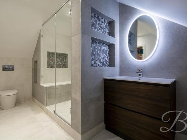 The en suite to the master bedroom is quite superb. A contemporary, enclosed shower is complemented by a vanity unit, low-flush WC, illuminated mirror and heated towel-rail.