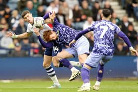 Preston North End's Jordan Storey battles for possession with Norwich City's Josh Sargent
