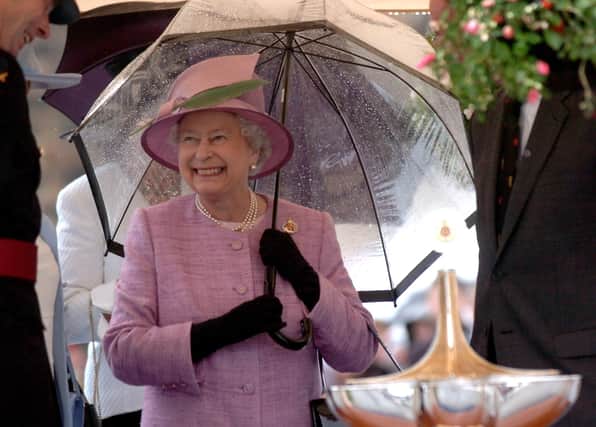 Queen Elizabeth's warm smile shines through on a rainy Lancashire afternoon in 2008. This is how our county will remember her