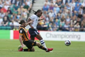 Daniel Johnson rides a tackle from Lewie Coyle.