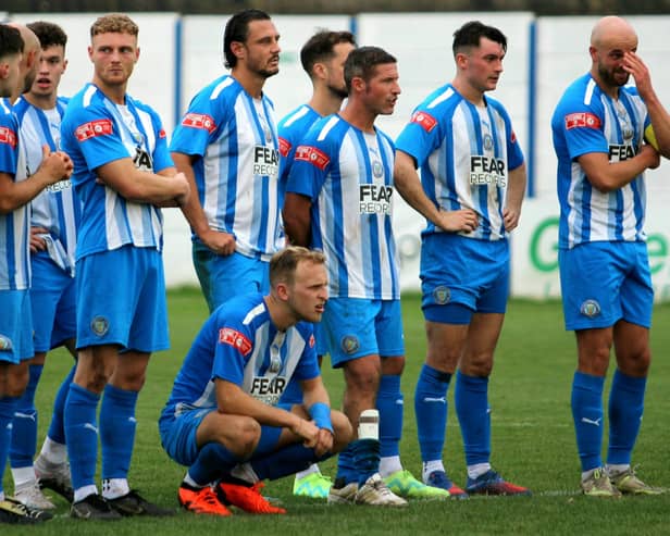 Players look on anxiously during the penalty shootout which Lancaster lost to City of Liverpool in the FA Trophy  Photo: JOSHUA BRANDWOOD