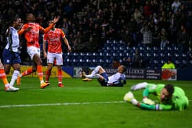 Preston North End striker Cameron Archer puts the ball in the Blackpool net at Deepdale