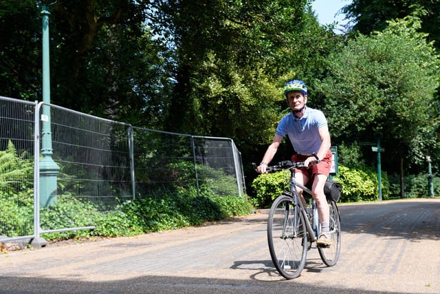 A cyclist in Avenham Park braving the blistering sun