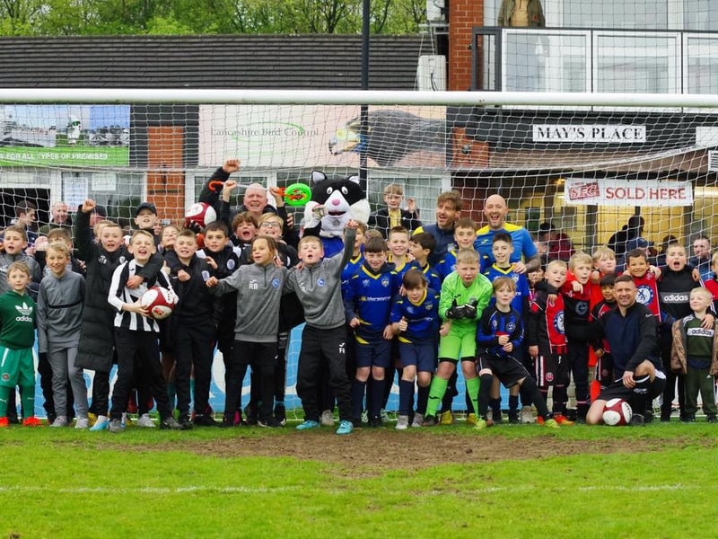 Lots of young fans post in the goalmouth after the game