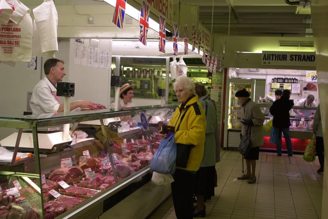 Pondering what to buy at the butchers stall at Preston's indoor market