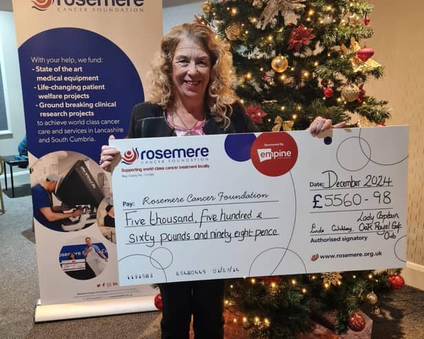 Retiring Lady Captain Linda Critchley with her donation for Rosemere Cancer Foundation