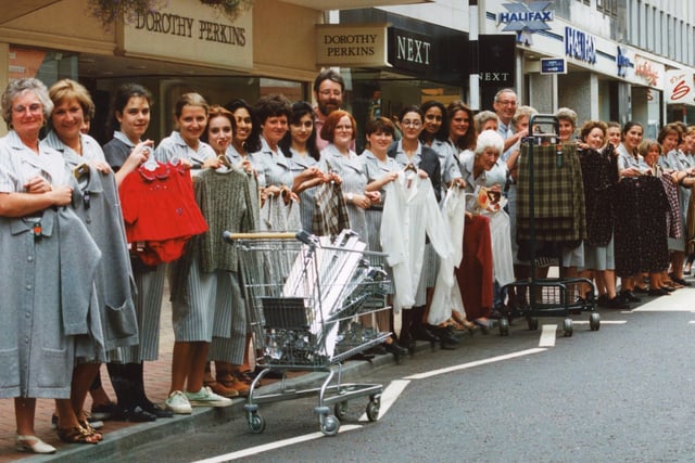 Chain store staff made a chain of their own as Preston's Marks & Spencer moved lock, stock and barrel to the other end of the road. Scores of staff worked through the night on the store swap as the firm closed its premises in the Fishergate Centre to consolidate in its site further up the road in 1994