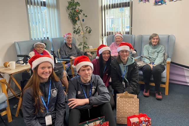 Nelson and Colne students spreading Christmas cheer. Photo: Age UK Lancashire