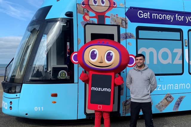 Boxer Jack Catterall launches the Mazuma tram in Blackpool, along with Maz the mascot